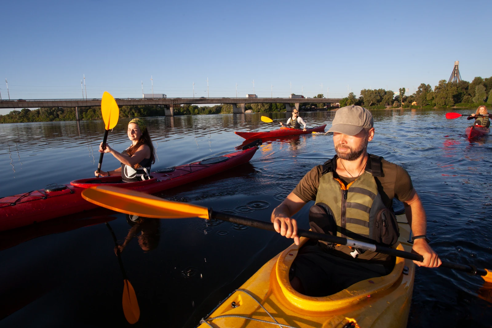A group of people kayaking on the lake