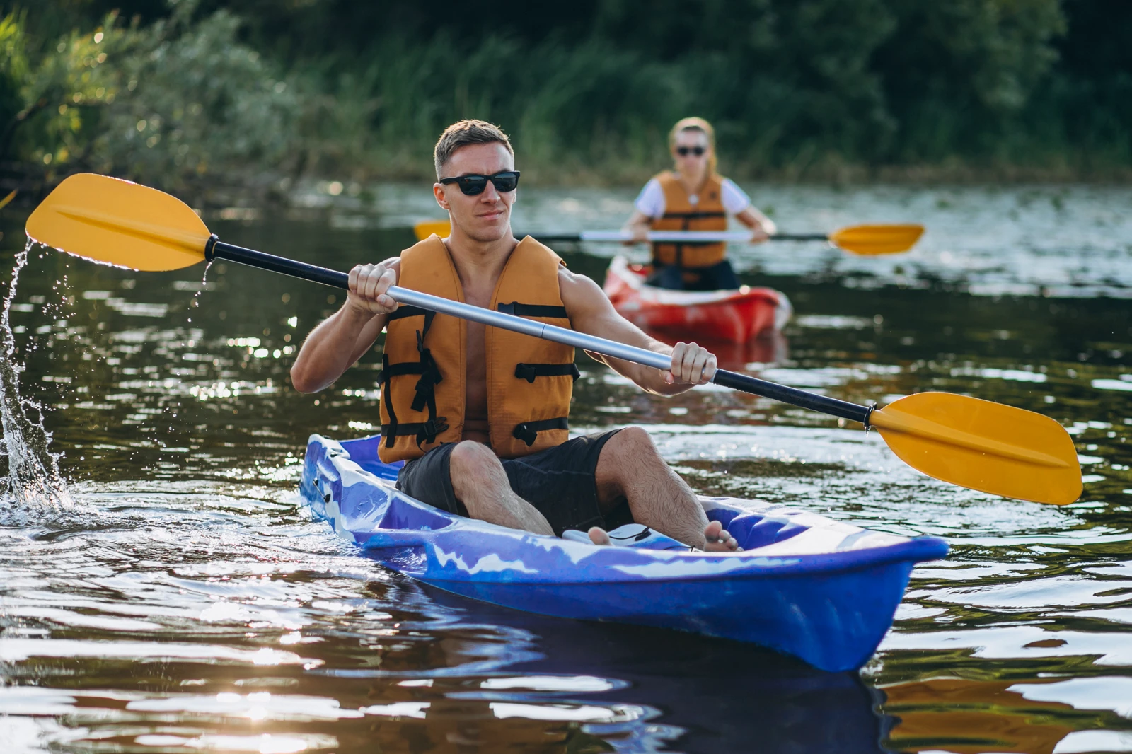 A group of people kayaking on the lake