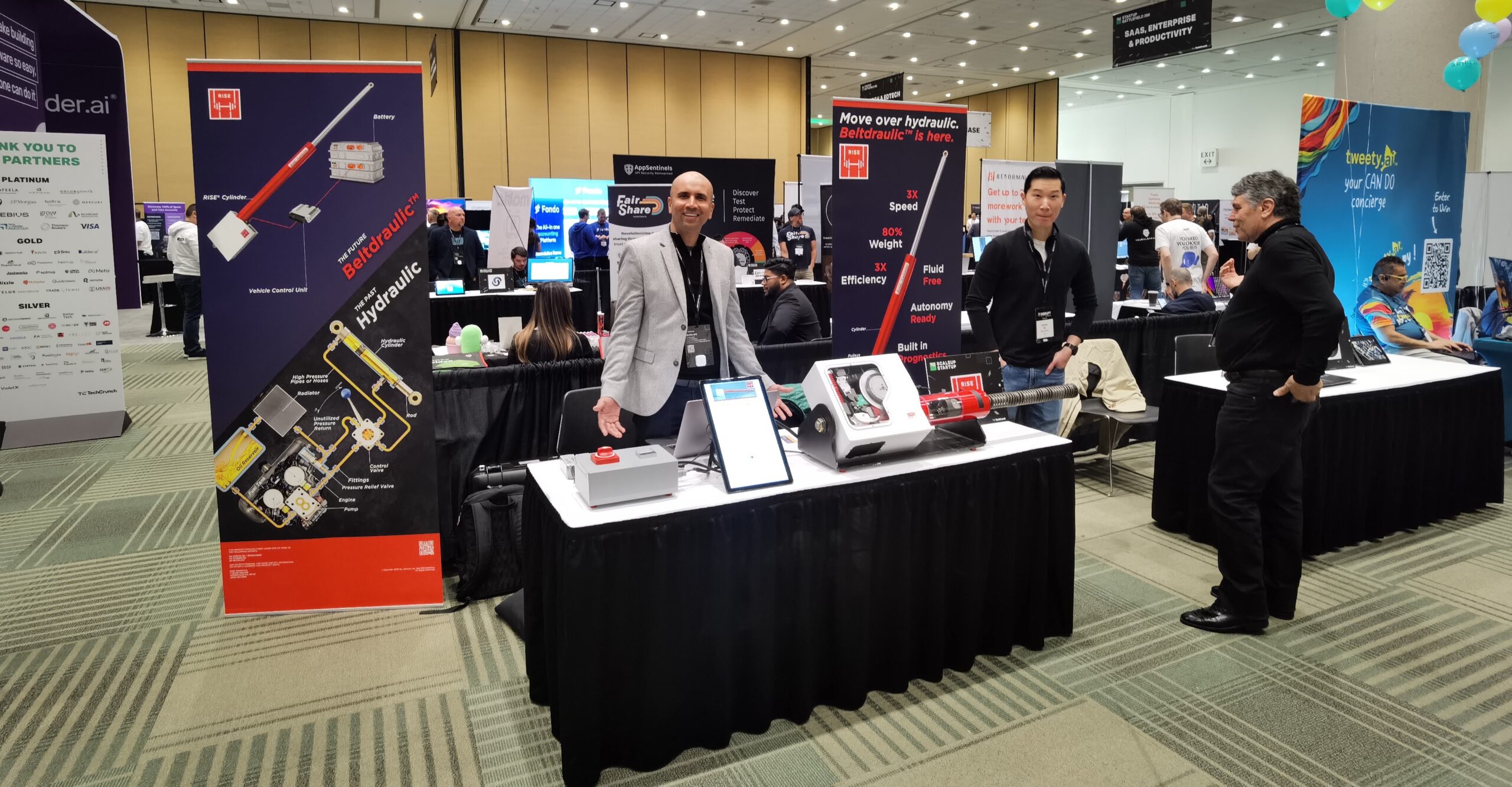 show exhibition booth featuring RISE Beltdraulic technology