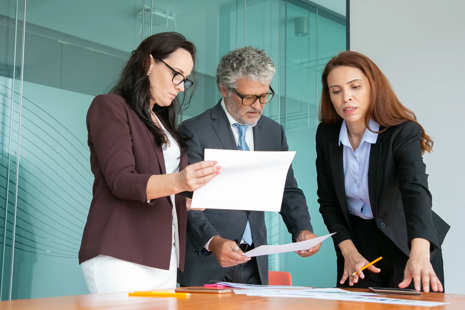 Executive team reviewing corporate strategy and financial reports