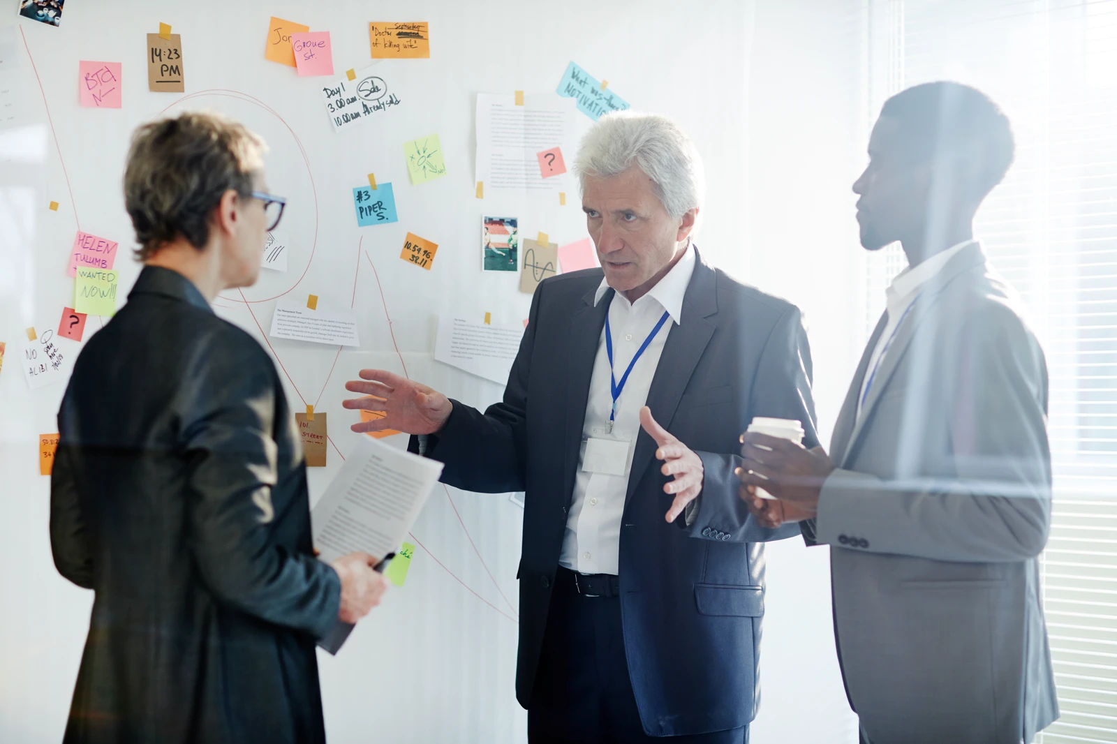 corporate executive leading a strategic business development meeting with team managers