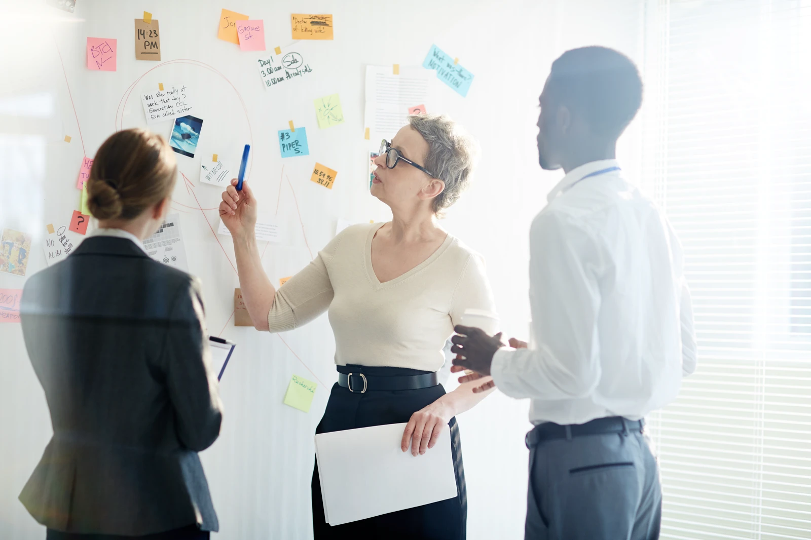 mapping out agile workflows and marketing campaign timelines on a brainstorming storyboard wall