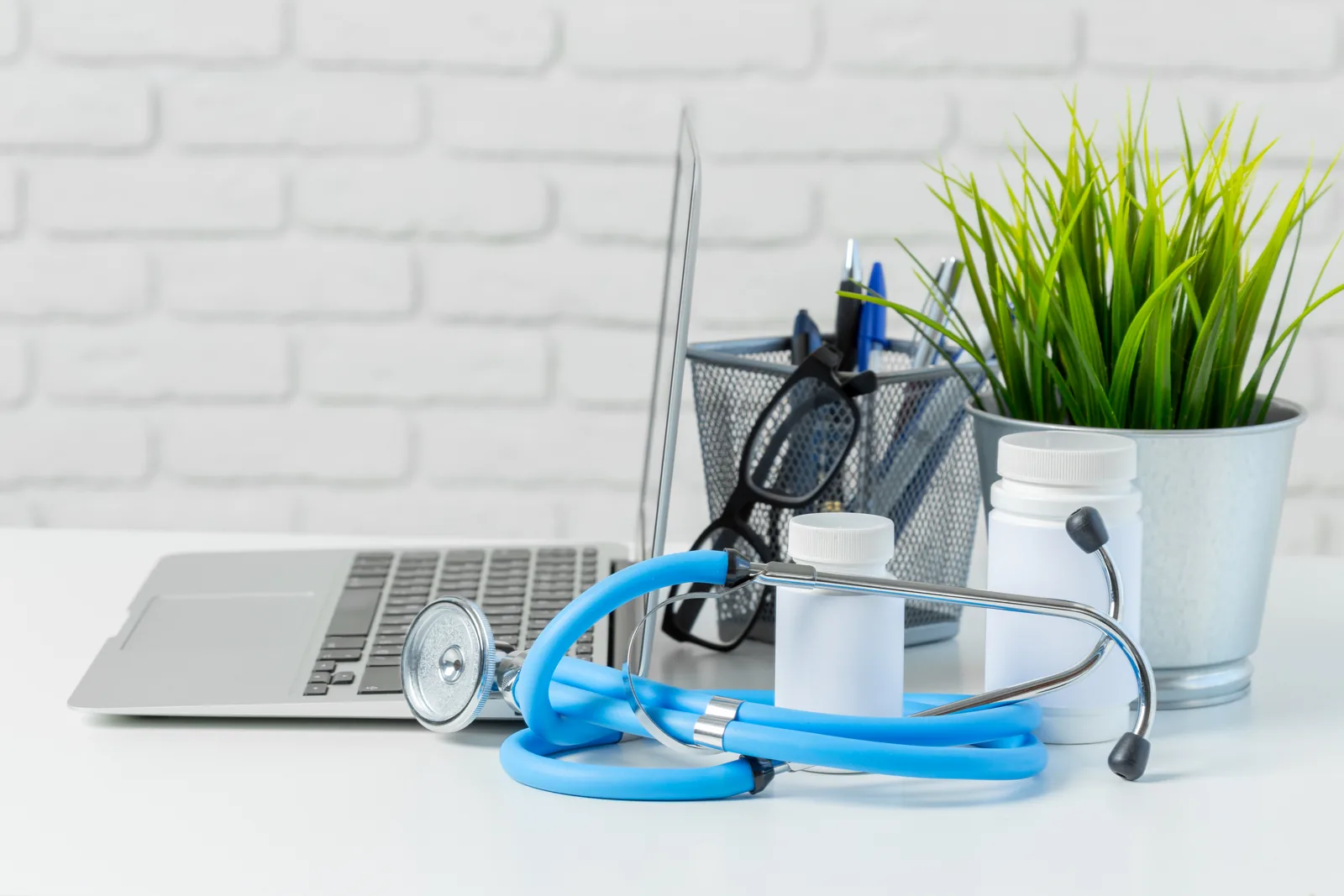 Stethoscope placed on the table along with the laptop